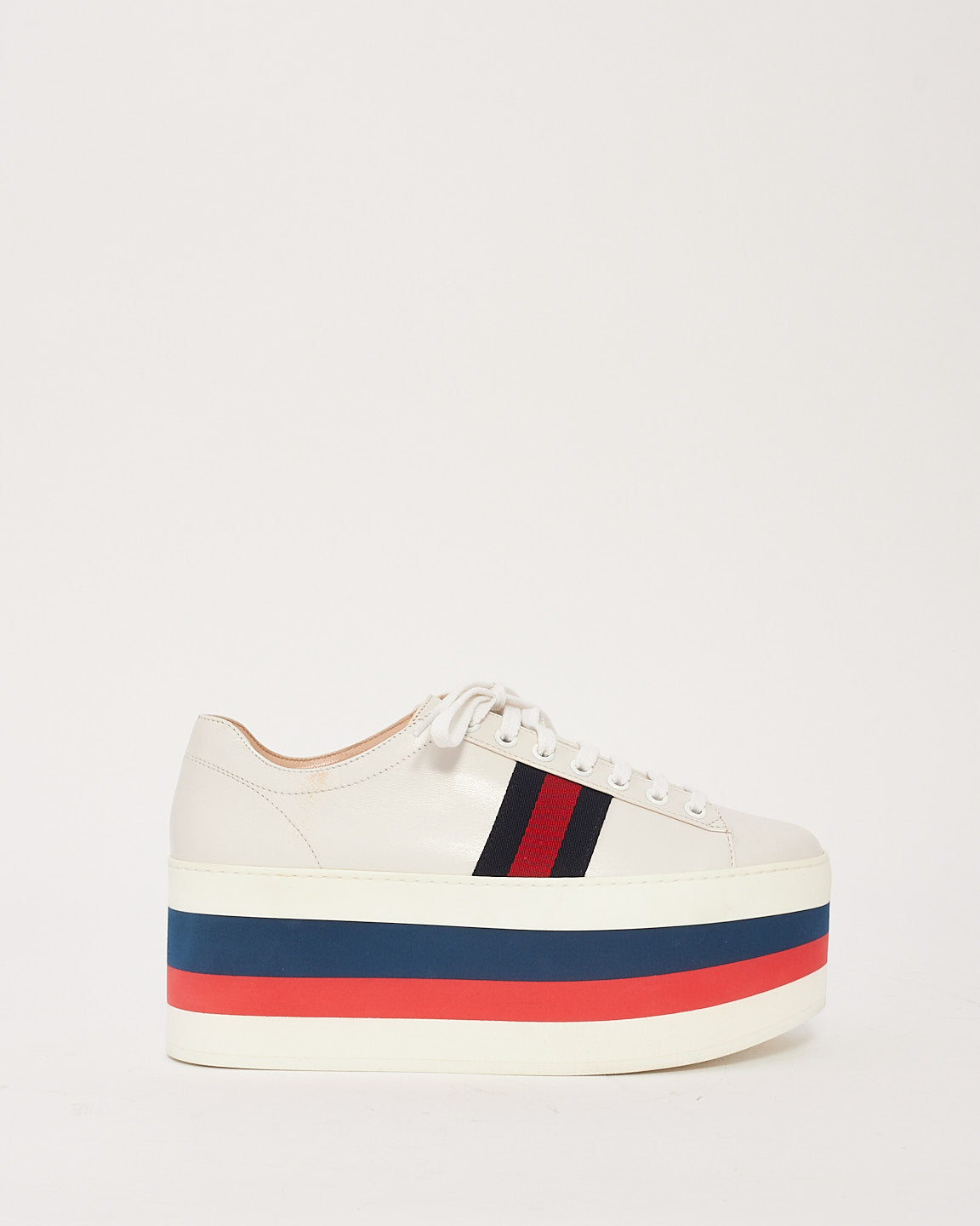 Explore a Gucci White Leather Peggy Platform Sneakers 38