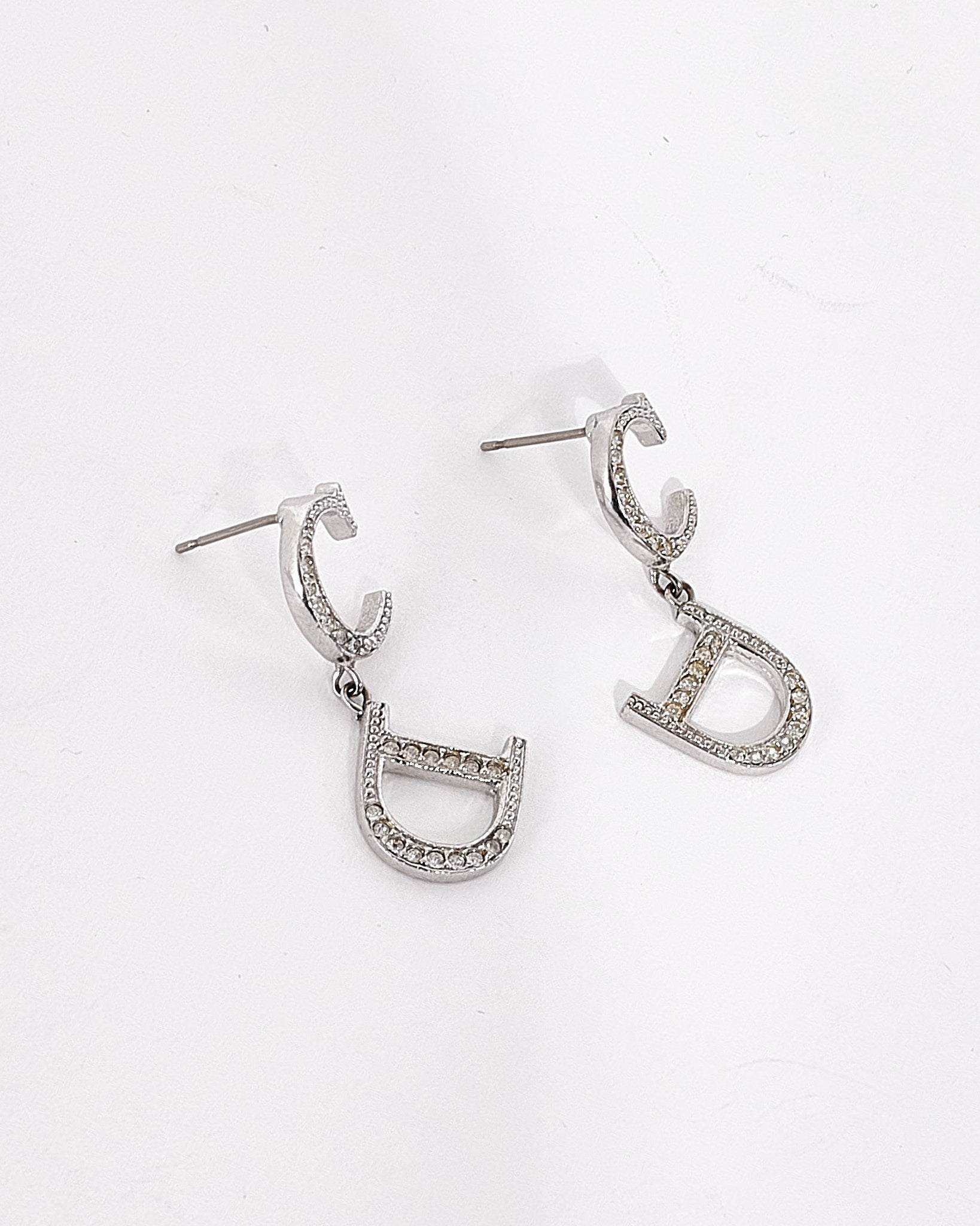 Explore a Dior Vintage Silver CD Logo Rhinestone Earrings