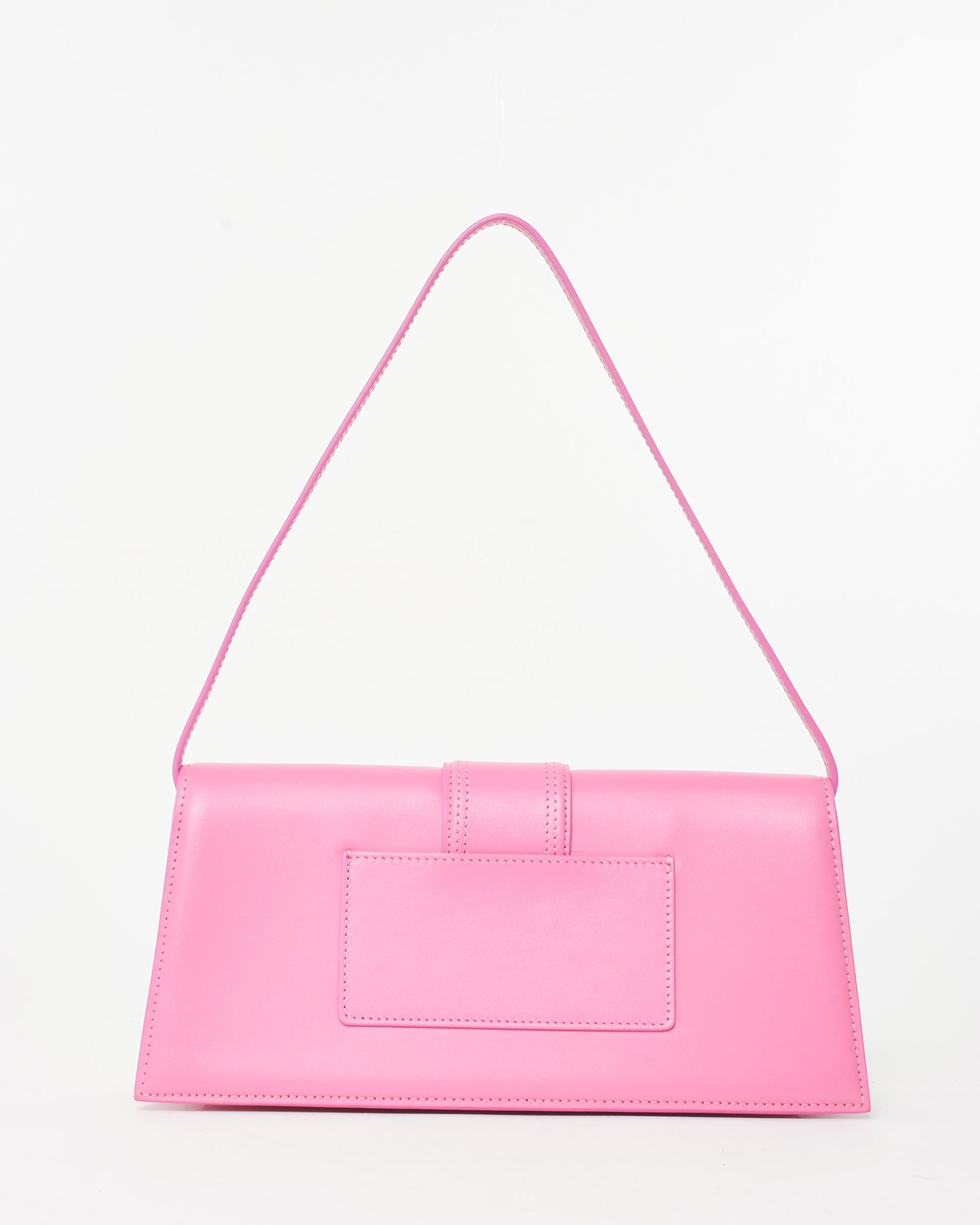 Pre-owned Jacquemus Le Bambino Long bag in soft pink leather, featuring a sleek rectangular silhouette, an extended front flap with tonal stitching, a thin shoulder strap, and gold-tone Jacquemus logo, back view.