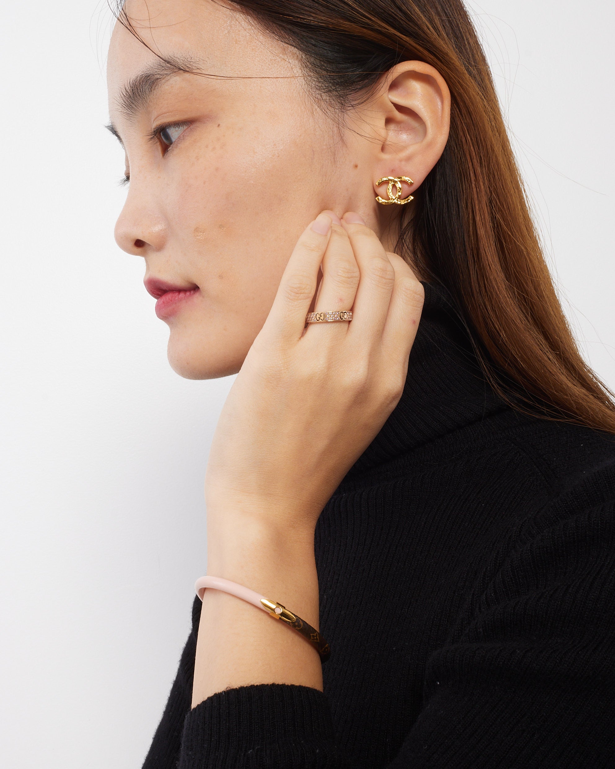 Explore a Chanel Gold Hammered Metal CC Logo Earrings