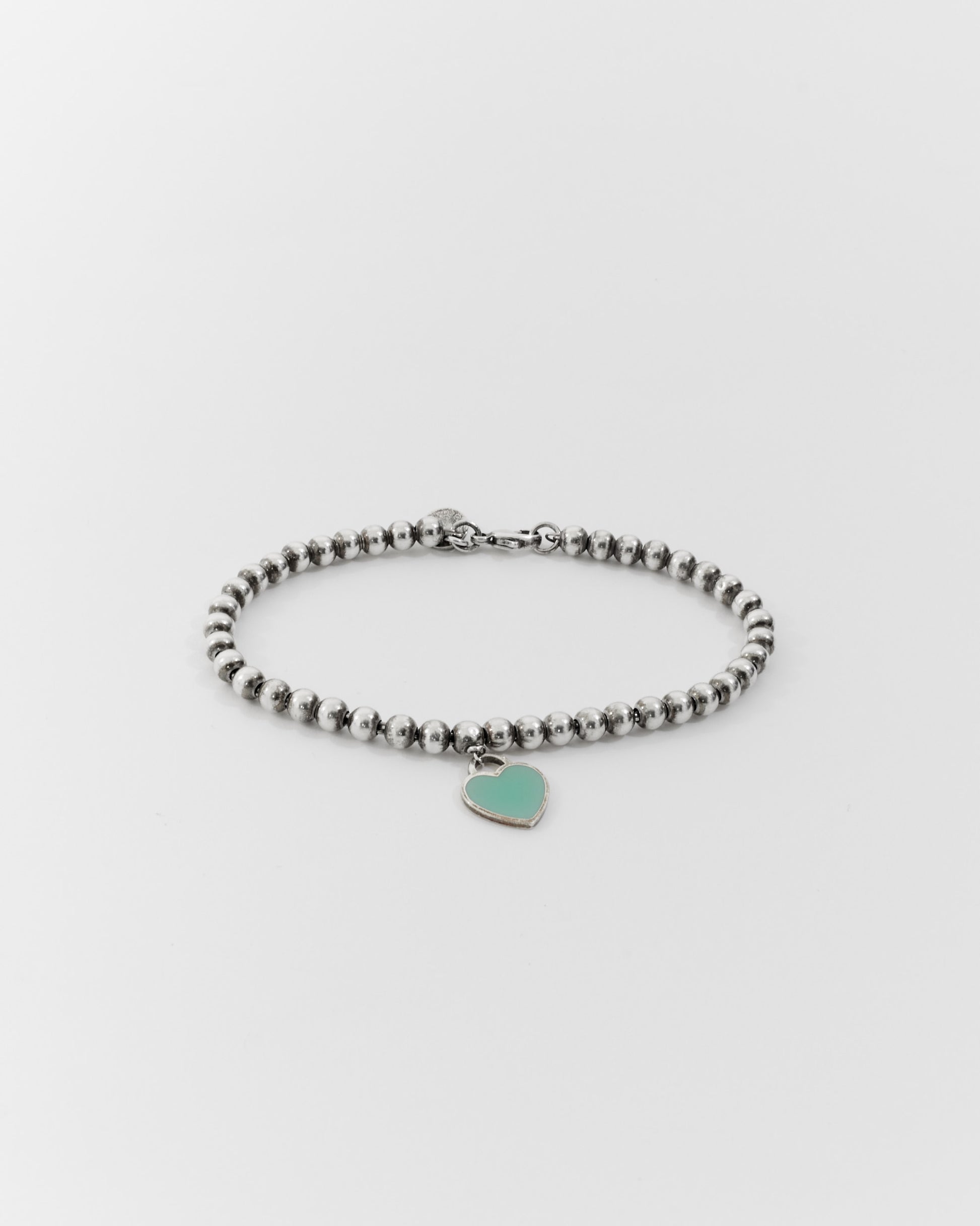 Explore a Tiffany Sterling Silver Blue Heart Tag Beaded