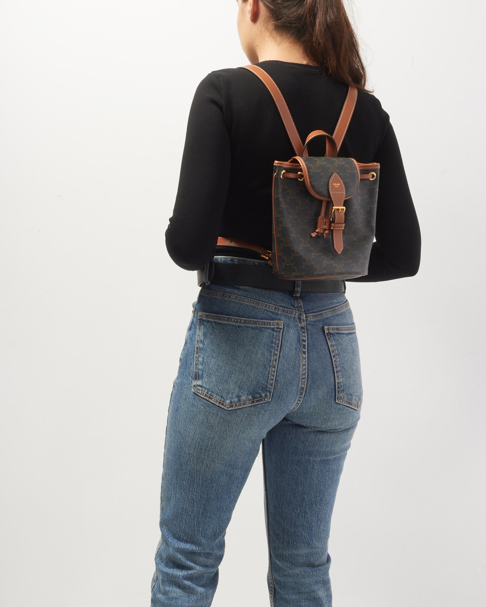 Explore a Celine Monogram Triomphe Canvas Mini Folco Backpack