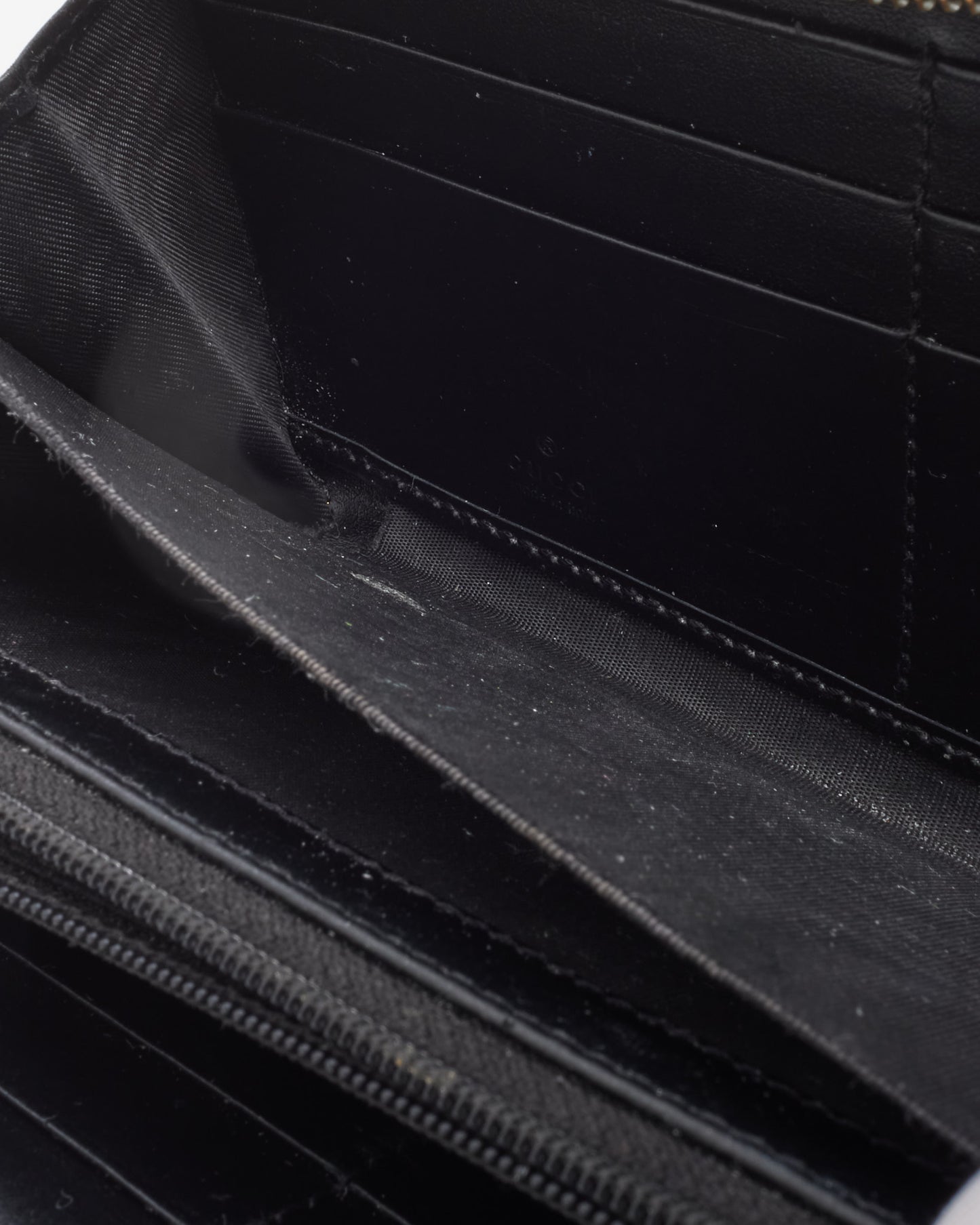 Portefeuille zippé GG Marmont en cuir Matlasseé noir Gucci