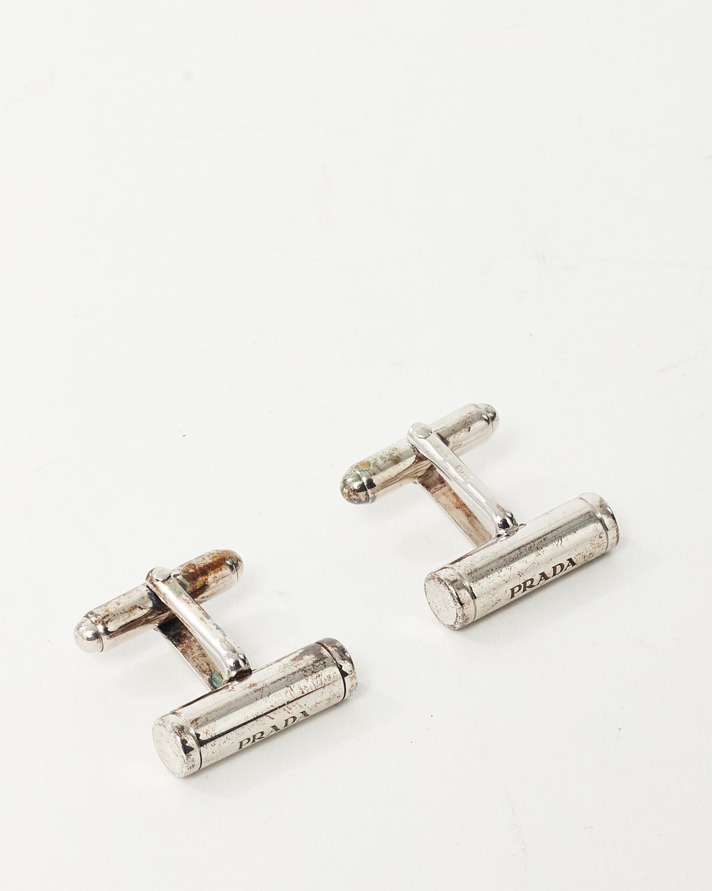 Boutons de manchette Prada logo barre en métal argenté avec boîte