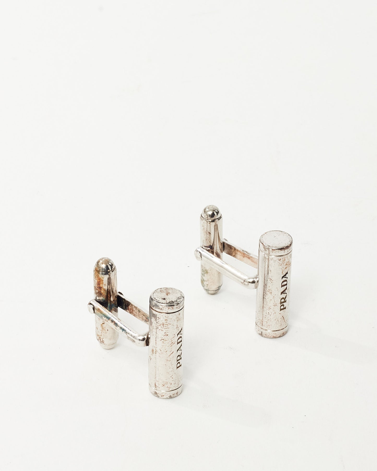 Boutons de manchette Prada logo barre en métal argenté avec boîte