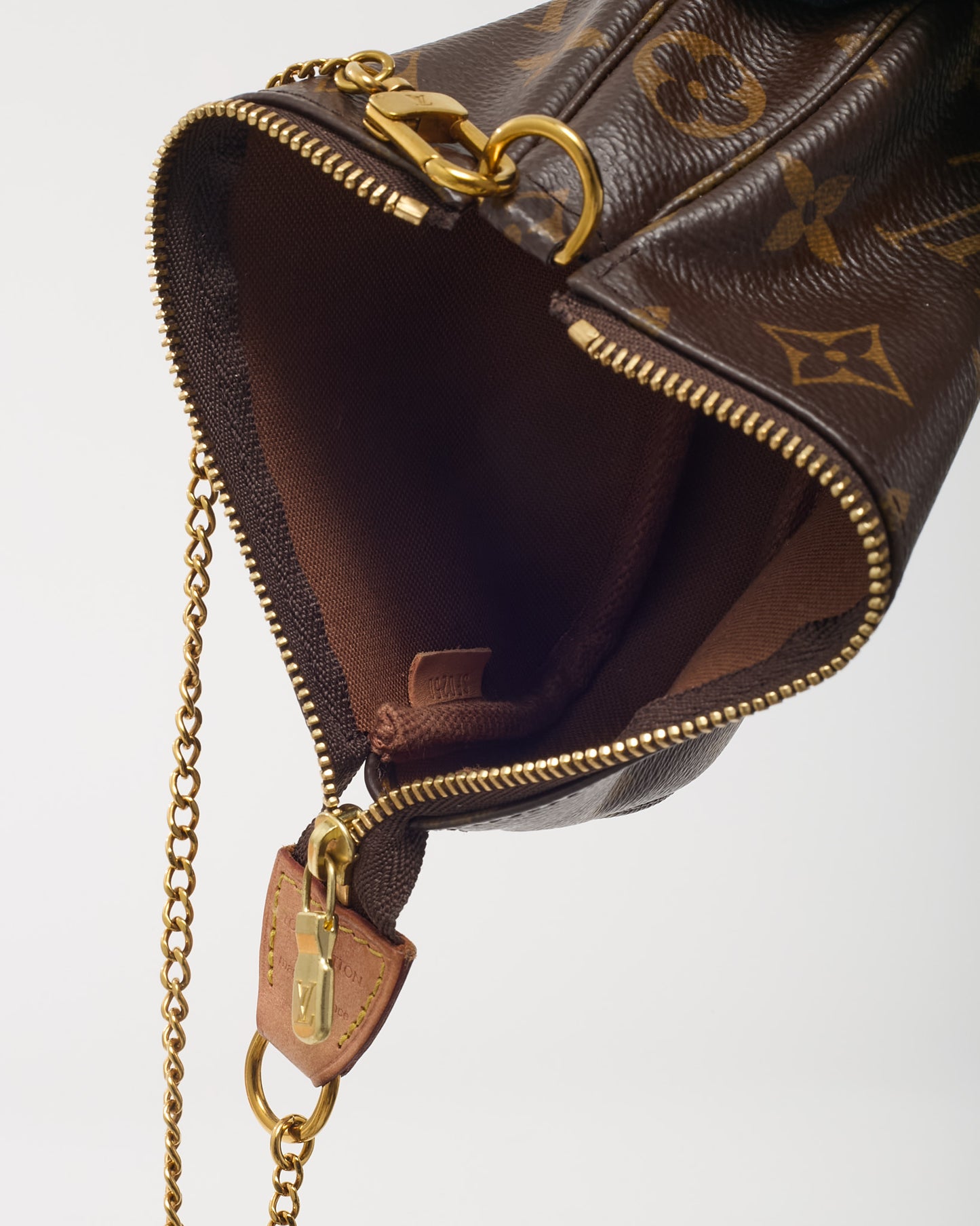 Mini Pochette Accessoires en toile Monogram Louis Vuitton