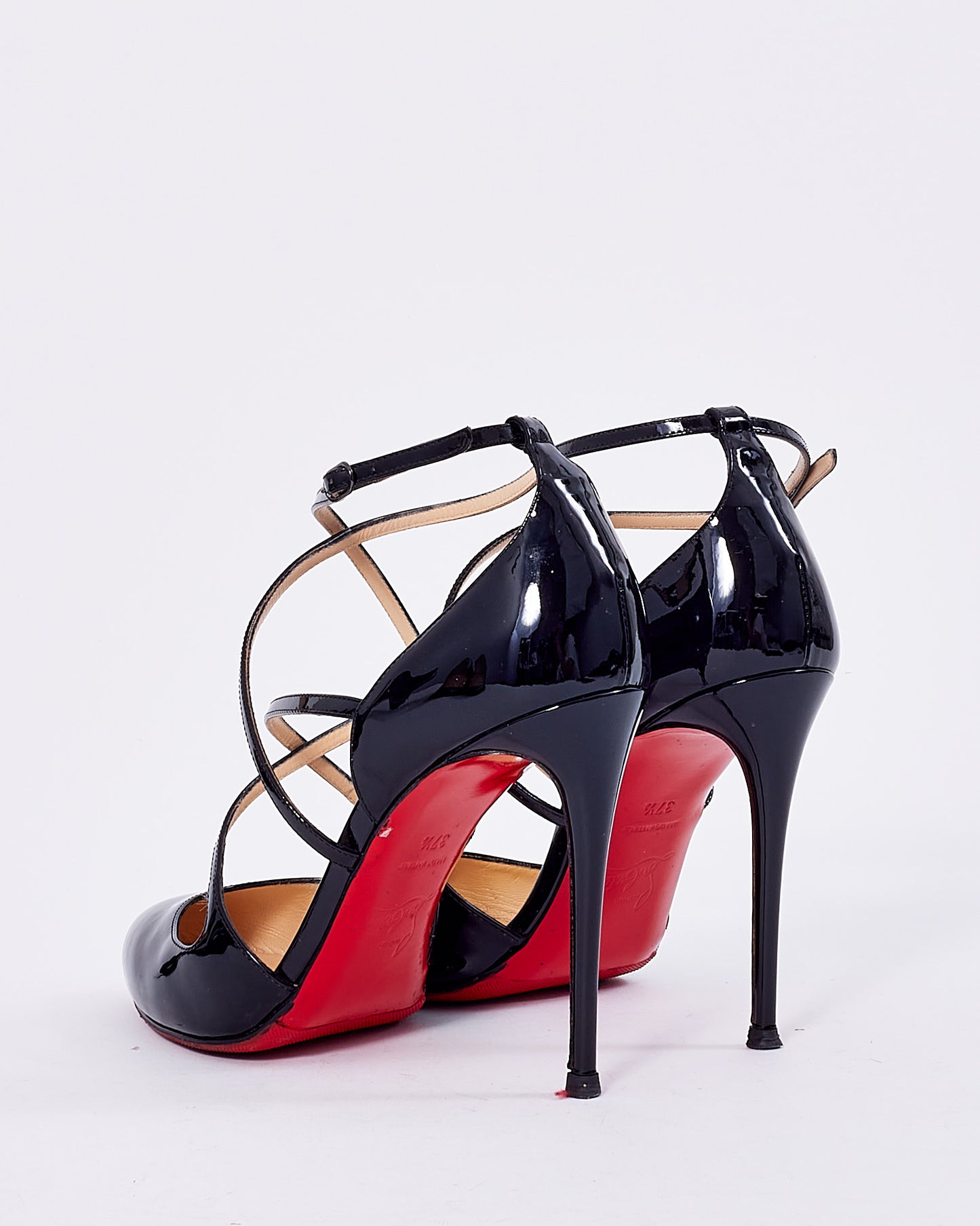 Explore a Christian Louboutin Black Patent Platform Strap Pumps