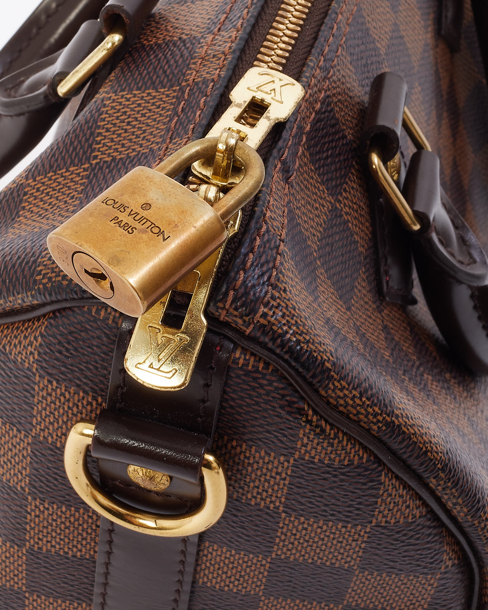 Explore a Louis Vuitton Damier Ebene Canvas Speedy Bandoulière 25