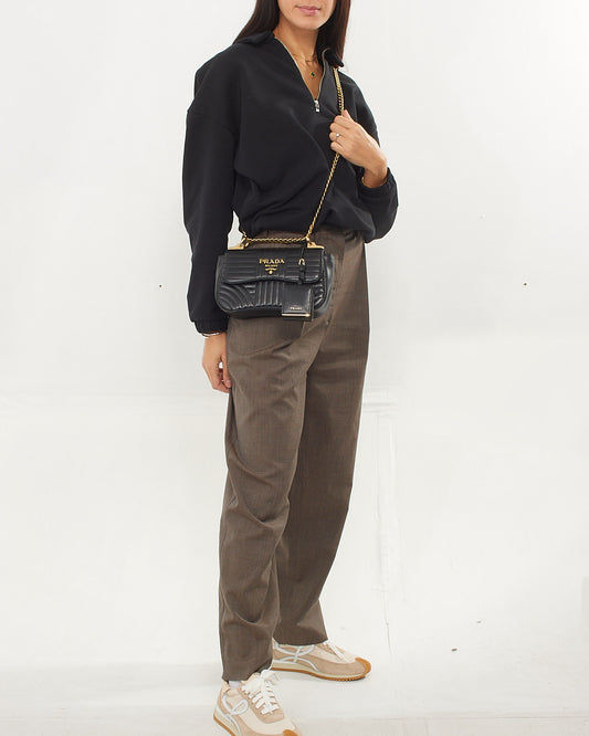 Explore a Prada Black Quilted Leather Curved Diagramme Flap Chain