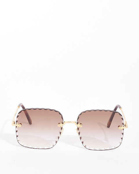 Explore a Chloé Gold Metal Rimless CE161S Rosie Sunglasses 