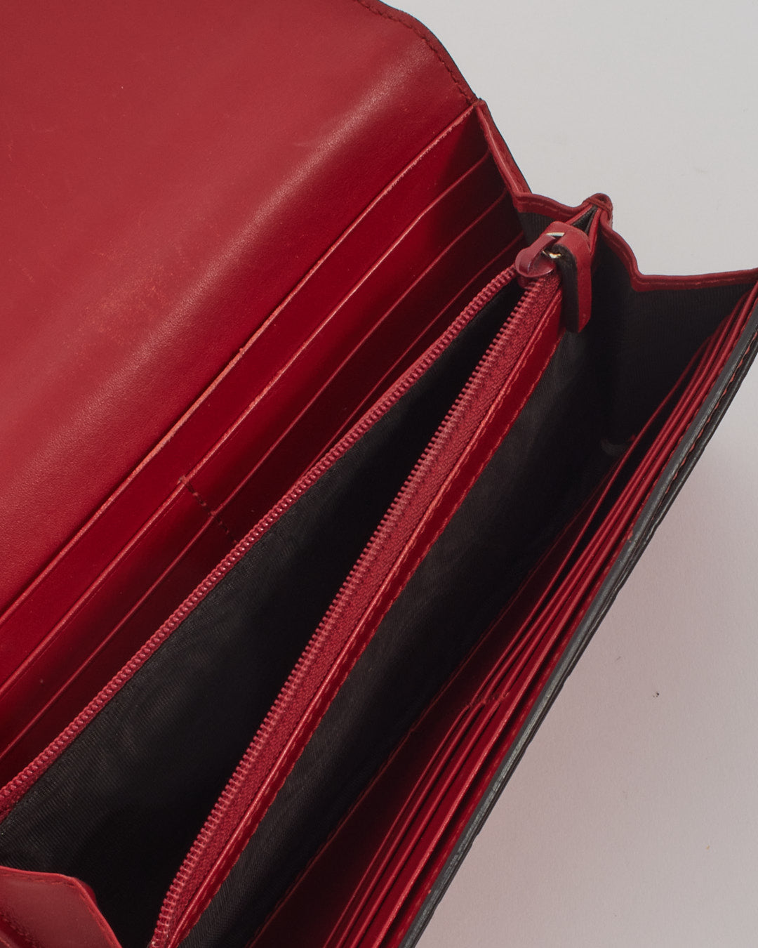 Portefeuille continental à nœud Guccissima en cuir rouge Gucci