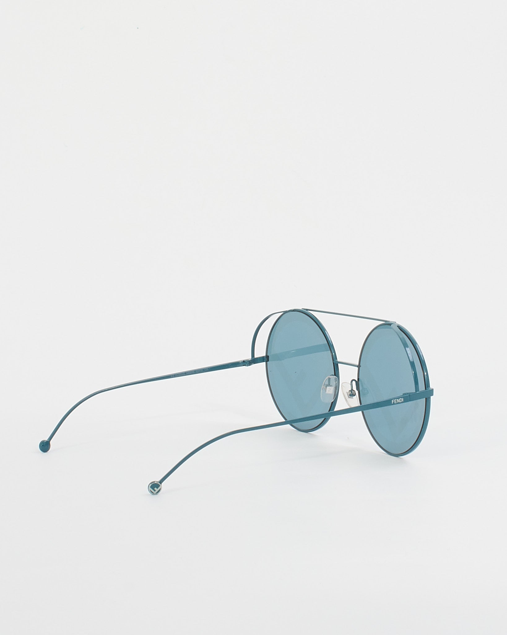 Explore a Fendi Blue Metal Frame Logo Lense Round Sunglasses