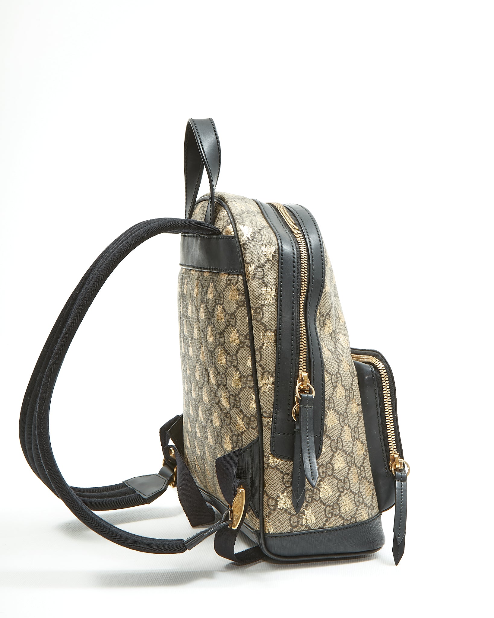 Explore a Gucci GG Supreme Canvas Small Bee Backpack