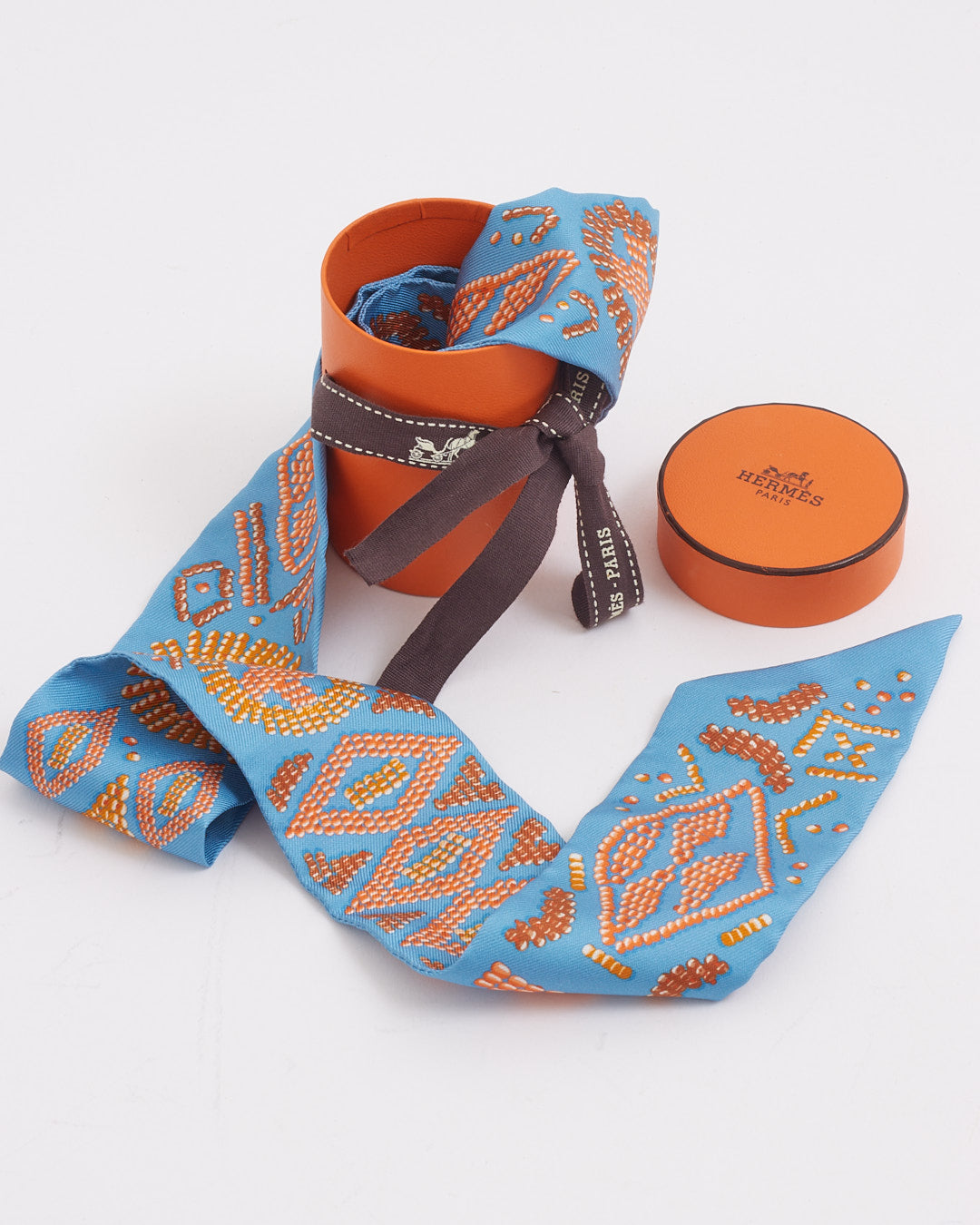 Hermès Twilly imprimé en soie bleu/orange