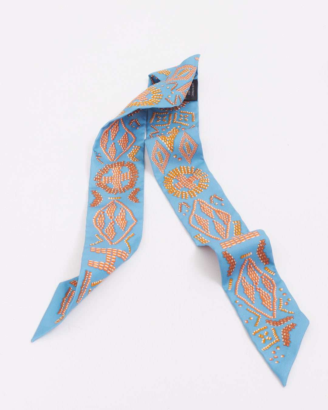 Hermès Twilly imprimé en soie bleu/orange