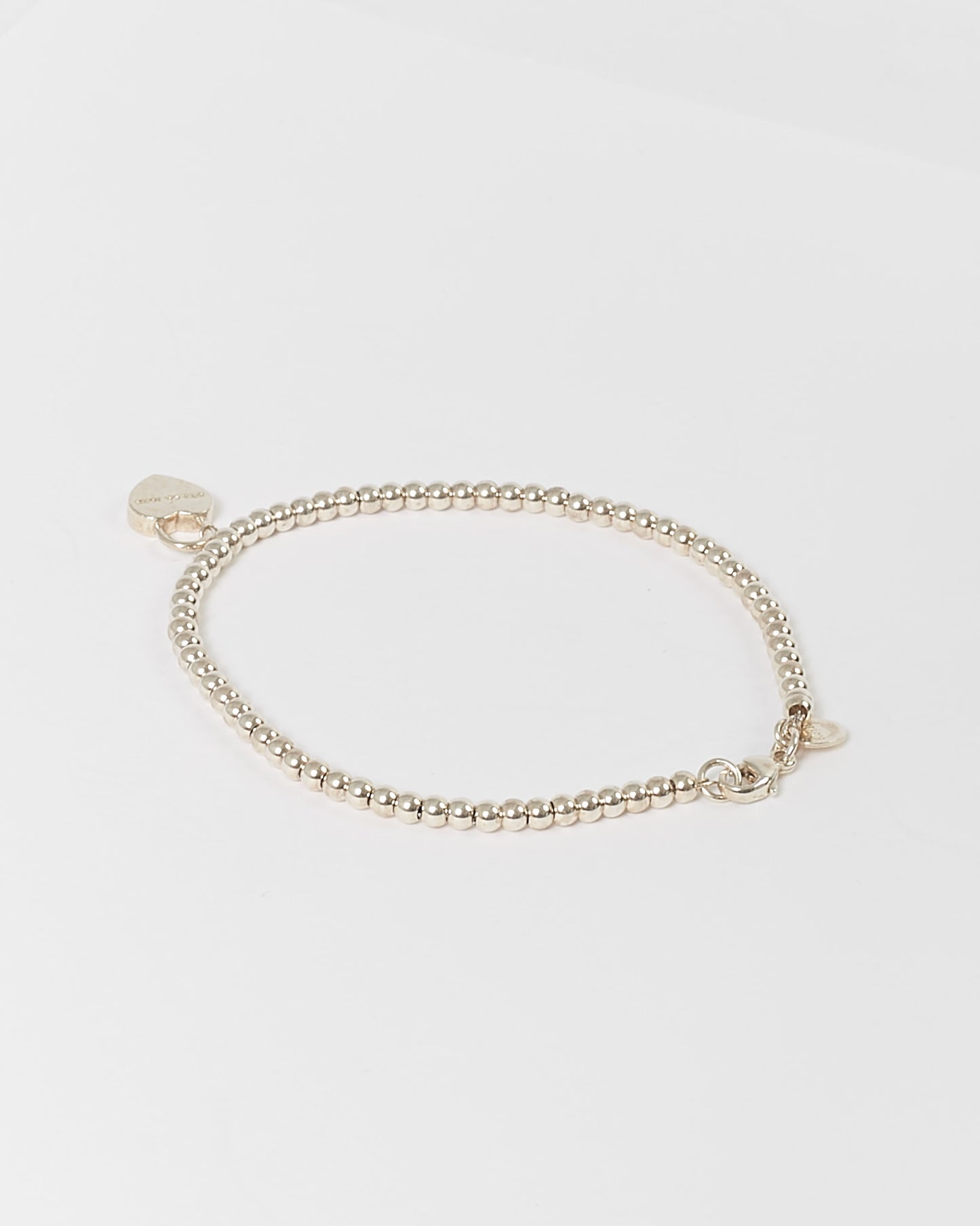 Tiffany &amp; Co Bracelet à perles fines avec pendentif cœur en argent sterling
