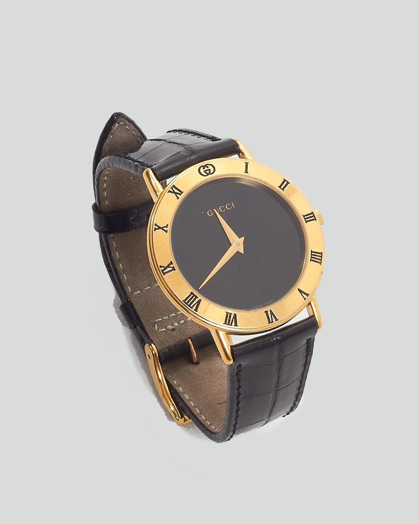 Montre Gucci Vintage avec bracelet en cuir d'alligator doré/noir